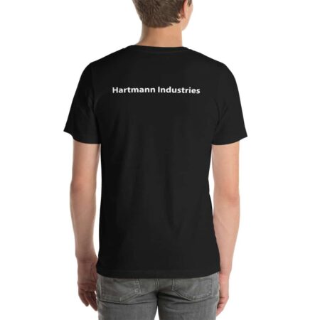Photo of a man wearing a black t-shirt, taken from the back. The shirt says "Hartmann Industries" in white text